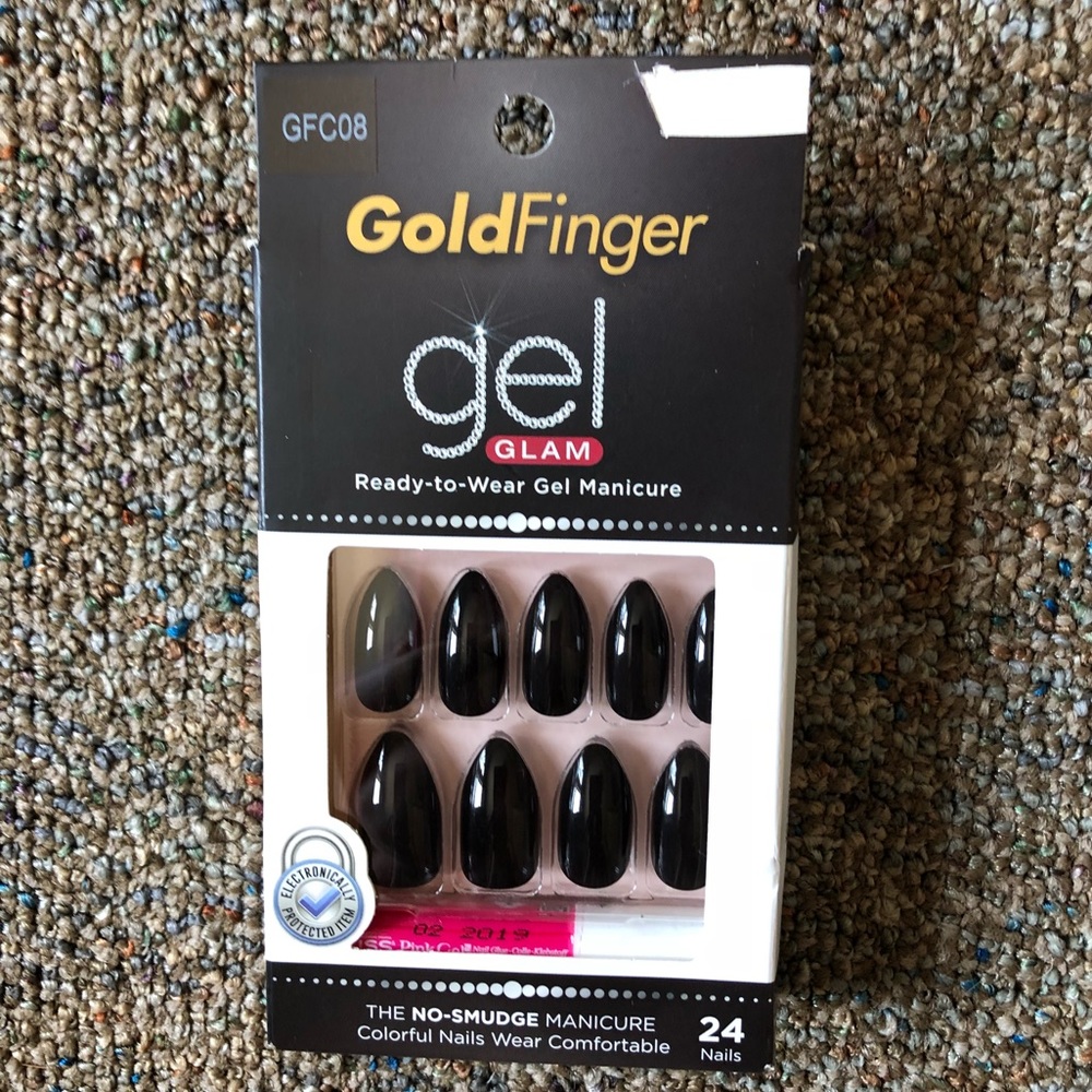 Black stiletto glue on fake nails